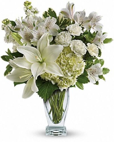 <div class="m-pdp-tabs-description">
<div id="mark-1" class="m-pdp-tabs-marketing-description">Who's the fairest of them all? This snow-white bouquet. A stunning statement of your purest love, this mix of hydrangea and lilies in a Couture vase will take their heart away.</div>
</div>
<p id="arrngDescp">This snow-white bouquet includes hydrangea, asiatic lilies, alstroemeria, miniature carnations, stock and fresh green pittosporum.</p>